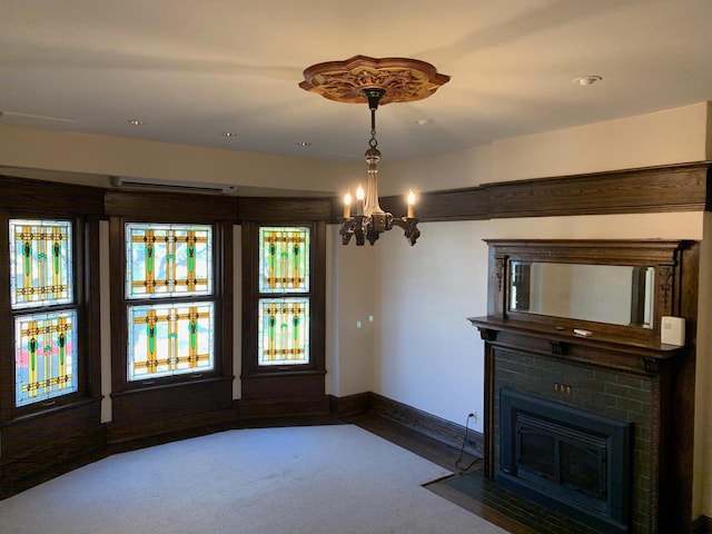 2723 N Downer Ave Unit 2725, 2725A, Milwaukee, WI 53211 - unfurnished dining area with carpet, a chandelier, a fireplace with flush hearth, and baseboards