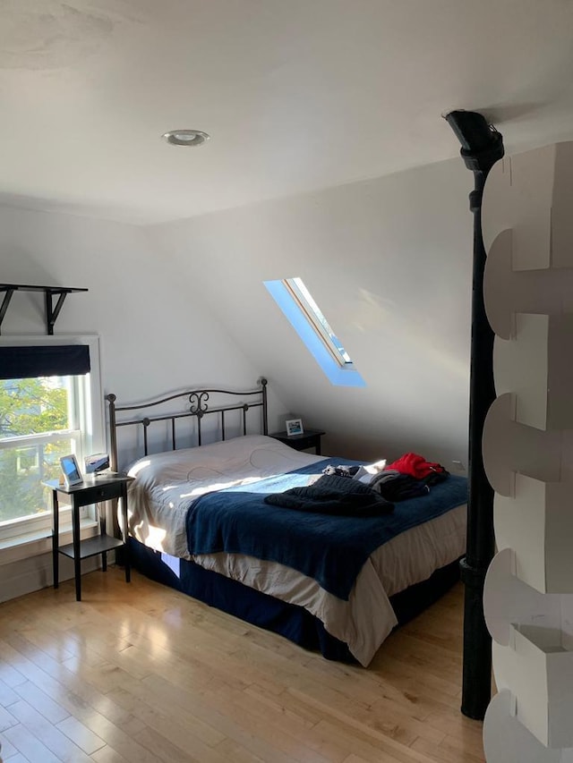 2723 N Downer Ave Unit 2725, 2725A, Milwaukee, WI 53211 - bedroom with a skylight, hardwood / wood-style flooring, and lofted ceiling
