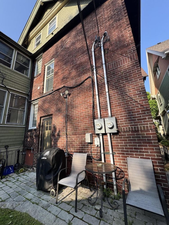 2723 N Downer Ave Unit 2725, 2725A, Milwaukee, WI 53211 - rear view of house with brick siding and a patio