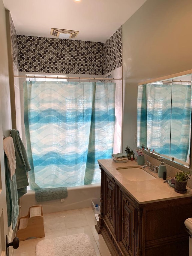 2723 N Downer Ave Unit 2725, 2725A, Milwaukee, WI 53211 - full bath featuring shower / bath combo with shower curtain, vanity, tile patterned flooring, and toilet
