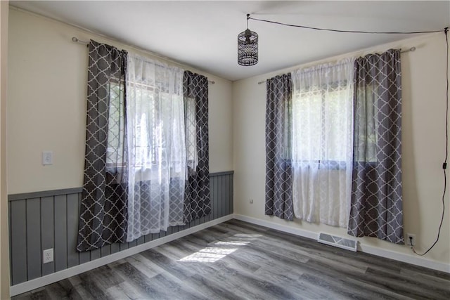 N211 County Road J, Hatfield, WI 54754 - spare room with plenty of natural light, wainscoting, and wood finished floors