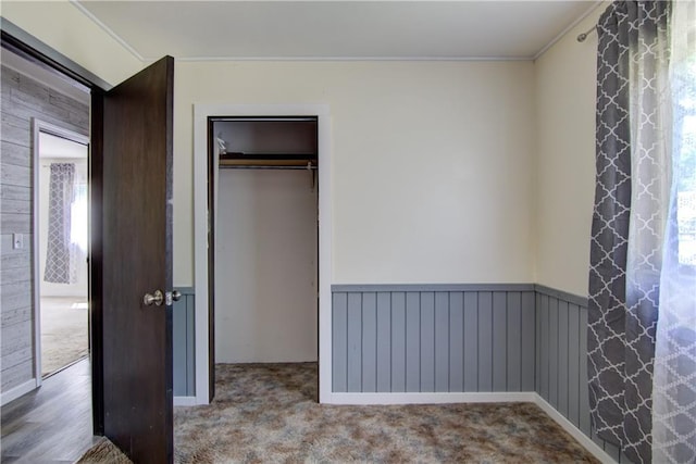 N211 County Road J, Hatfield, WI 54754 - unfurnished bedroom featuring crown molding, a closet, and carpet