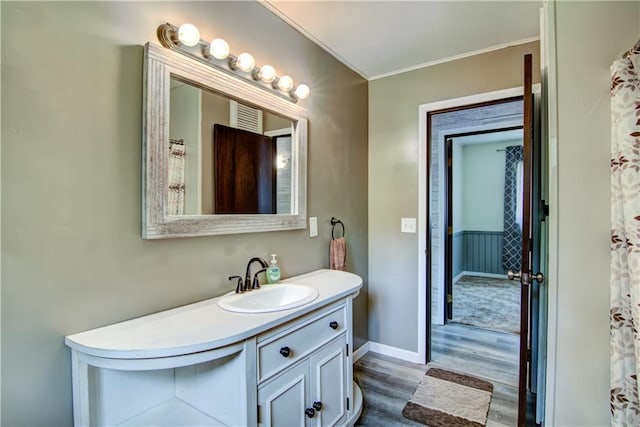 N211 County Road J, Hatfield, WI 54754 - full bathroom with wood finished floors, vanity, crown molding, and baseboards