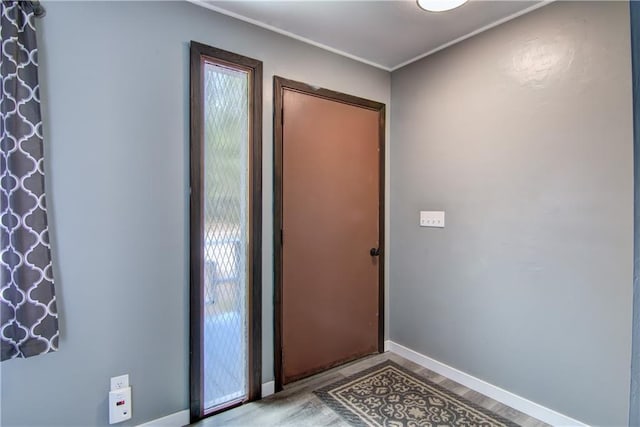 N211 County Road J, Hatfield, WI 54754 - doorway to outside featuring wood finished floors, baseboards, and ornamental molding
