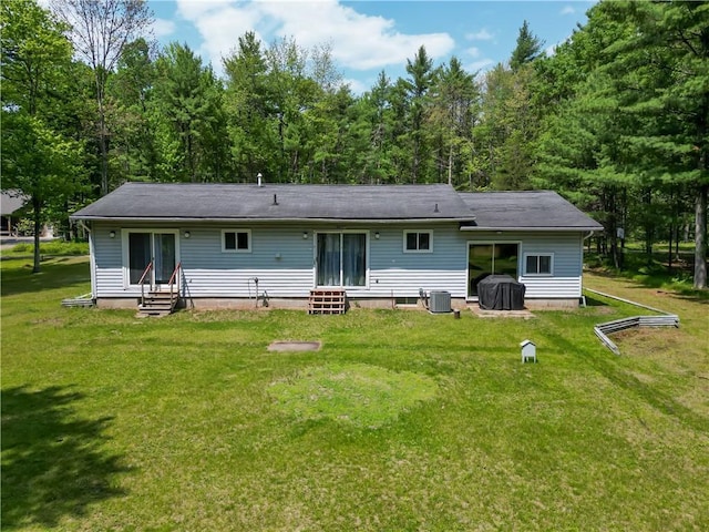 N211 County Road J, Hatfield, WI 54754 - back of property with entry steps, central air condition unit, a yard, and a view of trees