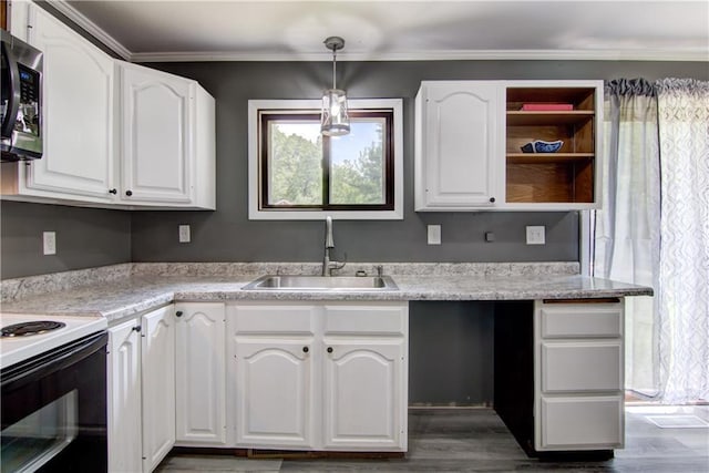 N211 County Road J, Hatfield, WI 54754 - kitchen with a sink, stainless steel microwave, white cabinetry, dark wood-type flooring, and crown molding