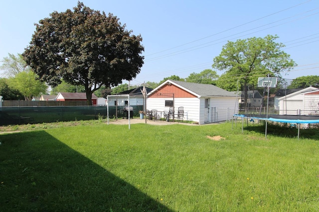 3253 S 68th St, Milwaukee, WI 53219 - view of yard featuring a trampoline and an outdoor structure