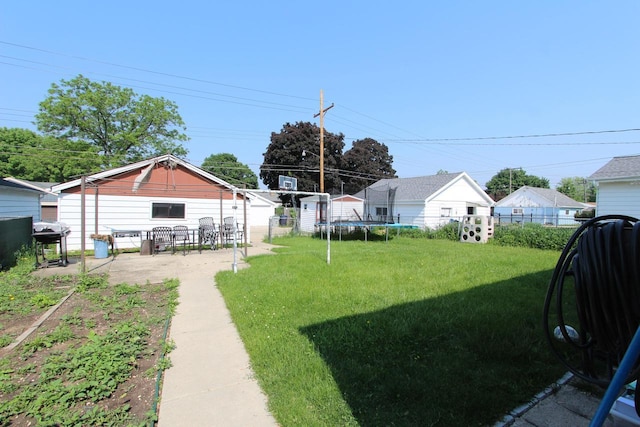 3253 S 68th St, Milwaukee, WI 53219 - view of yard with a trampoline and a patio area