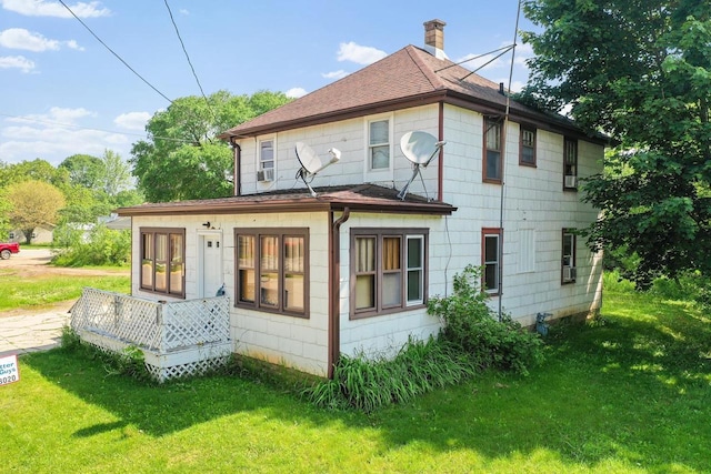 106 S Richmond Ave, Gillett, WI 54124 - back of property featuring a chimney, a yard, and a shingled roof