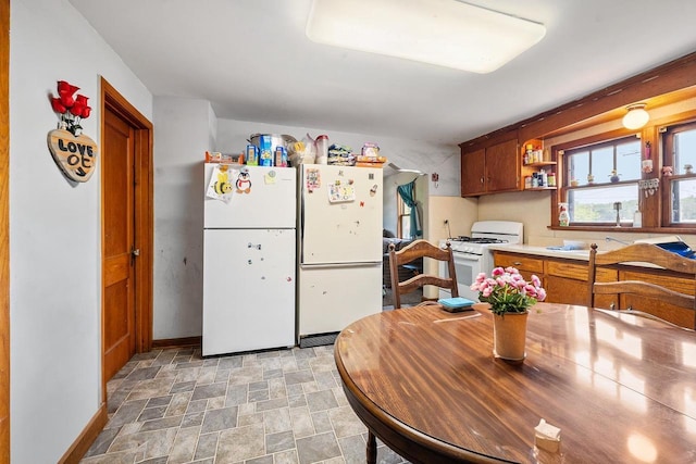 106 S Richmond Ave, Gillett, WI 54124 - kitchen featuring white appliances, stone finish flooring, baseboards, light countertops, and open shelves