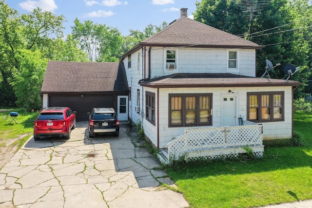 106 S Richmond Ave, Gillett, WI 54124 - view of front of home with a shingled roof, a front yard, concrete driveway, a garage, and cooling unit