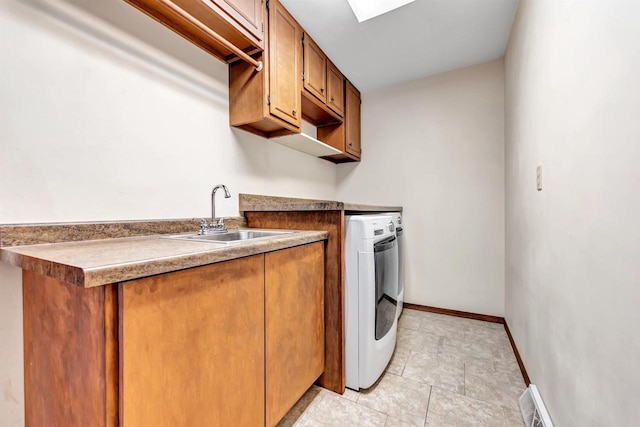 5073 Scottie Ct, New Franken, WI 54229 - laundry room with washer / dryer, cabinet space, and baseboards