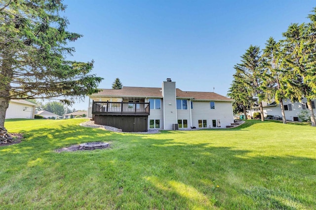 5073 Scottie Ct, New Franken, WI 54229 - back of house featuring a yard, a deck, and a chimney