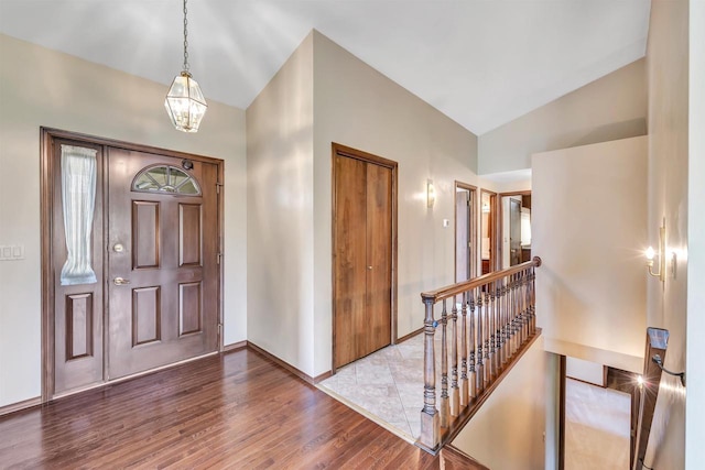 5073 Scottie Ct, New Franken, WI 54229 - foyer entrance featuring vaulted ceiling, wood finished floors, baseboards, and a chandelier