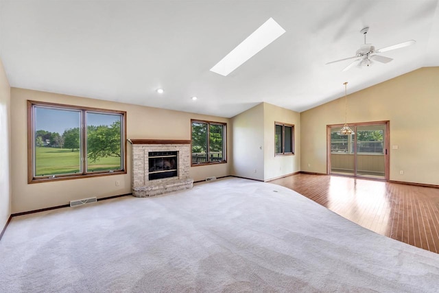 5073 Scottie Ct, New Franken, WI 54229 - unfurnished living room featuring plenty of natural light, baseboards, a fireplace, ceiling fan, and recessed lighting