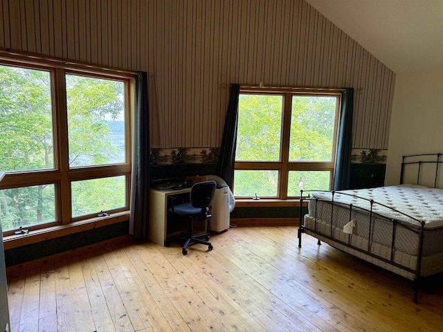 20675 Deer Island View Rd, Eastman, WI 54626 - bedroom with light wood-type flooring, wallpapered walls, a desk, and high vaulted ceiling