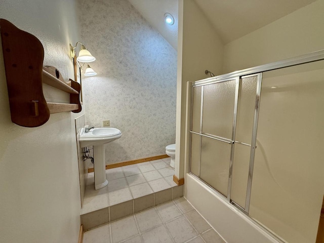 20675 Deer Island View Rd, Eastman, WI 54626 - full bathroom with toilet, lofted ceiling, bath / shower combo with glass door, baseboards, and tile patterned floors