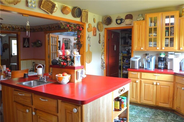 4878N Fur Farm Trl, Winter, WI 54896 - kitchen featuring a sink, an island with sink, and glass insert cabinets