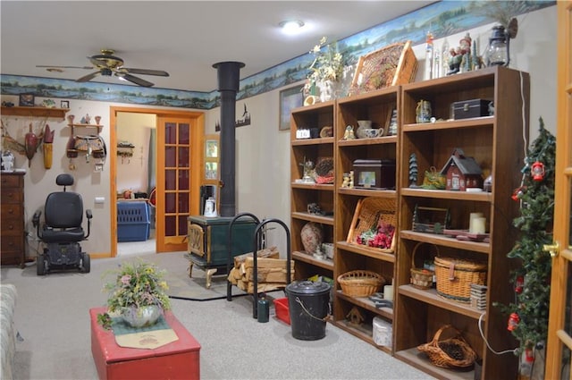 4878N Fur Farm Trl, Winter, WI 54896 - living area featuring a wood stove, carpet, and ceiling fan