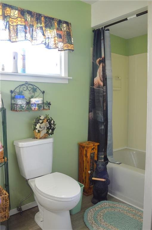 4878N Fur Farm Trl, Winter, WI 54896 - bathroom with toilet, shower / bath combo with shower curtain, and baseboards