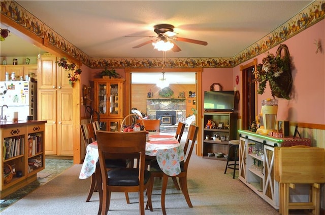 4878N Fur Farm Trl, Winter, WI 54896 - dining area featuring a ceiling fan and carpet floors