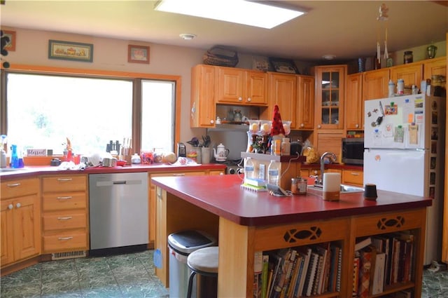 4878N Fur Farm Trl, Winter, WI 54896 - kitchen featuring stainless steel appliances, a sink, glass insert cabinets, an island with sink, and open shelves
