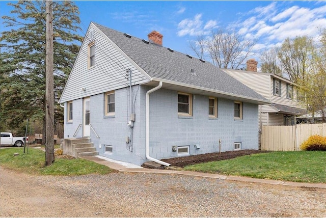 1365 Woodbridge St, Saint Paul, MN 55117 - view of side of property with a chimney and a shingled roof