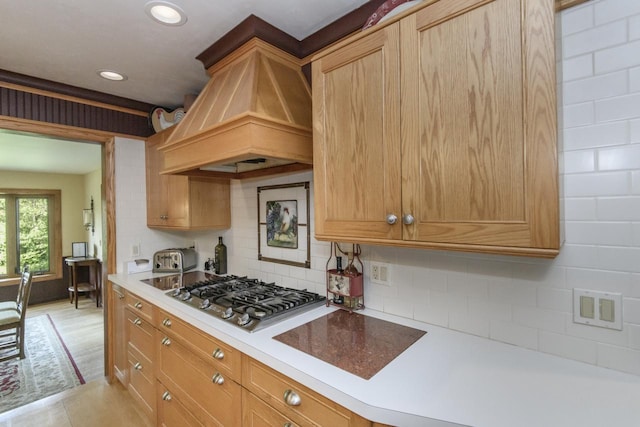 W338S4370 Drumlin Dr, Dousman, WI 53118 - kitchen featuring stainless steel gas stovetop, premium range hood, tasteful backsplash, light countertops, and recessed lighting
