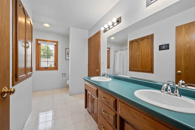 2592 Radinz Rd, Green Bay, WI 54311 - full bathroom featuring double vanity, toilet, tile patterned floors, and curtained shower