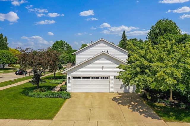 2592 Radinz Rd, Green Bay, WI 54311 - view of front of home with driveway, a front yard, and an attached garage