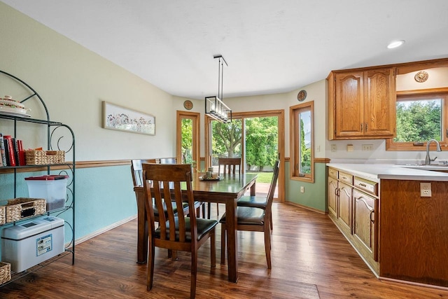 2592 Radinz Rd, Green Bay, WI 54311 - dining room with plenty of natural light, dark wood-style flooring, and baseboards