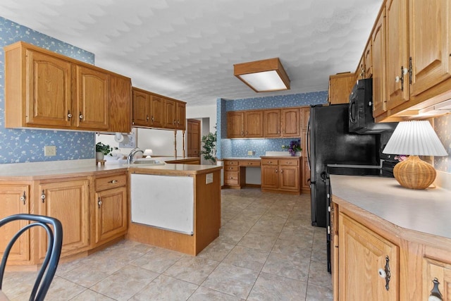 146 Old Orchard Ln, Neenah, WI 54956 - kitchen featuring wallpapered walls, a peninsula, black microwave, light countertops, and light tile patterned floors