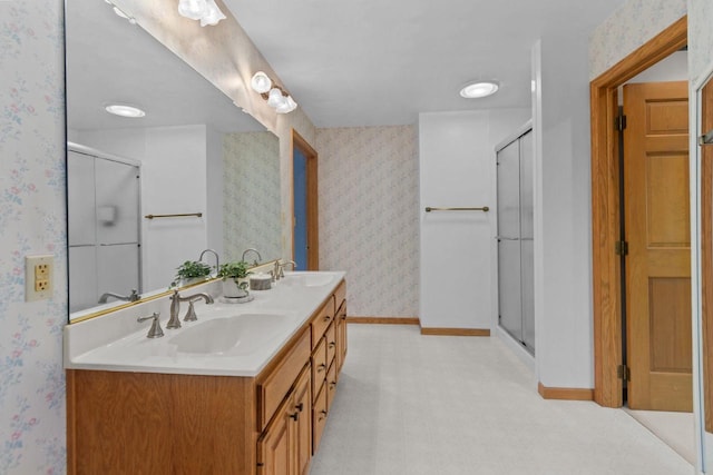 146 Old Orchard Ln, Neenah, WI 54956 - bathroom with wallpapered walls, baseboards, double vanity, and a shower with door
