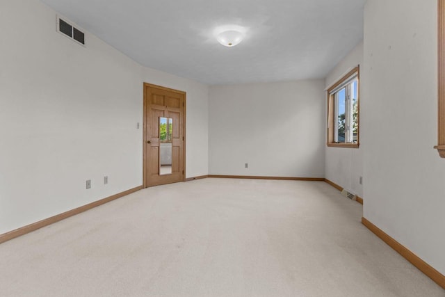 146 Old Orchard Ln, Neenah, WI 54956 - empty room with healthy amount of natural light, light colored carpet, and baseboards