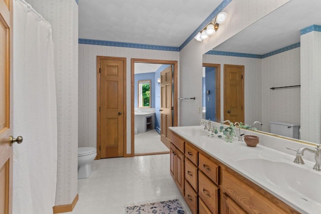 146 Old Orchard Ln, Neenah, WI 54956 - full bathroom with toilet, wallpapered walls, double vanity, and tile patterned floors