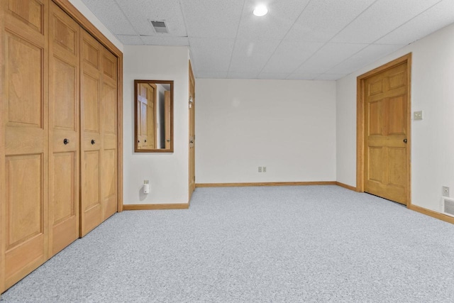 146 Old Orchard Ln, Neenah, WI 54956 - unfurnished bedroom featuring carpet floors, baseboards, a drop ceiling, and a closet