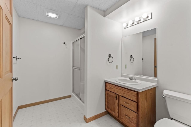 146 Old Orchard Ln, Neenah, WI 54956 - full bathroom with vanity, toilet, a shower stall, a paneled ceiling, and tile patterned floors