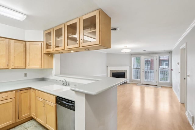 809 Harbor House Dr Unit 4, Madison, WI 53719 - kitchen with stainless steel dishwasher, a sink, light brown cabinetry, glass insert cabinets, and crown molding