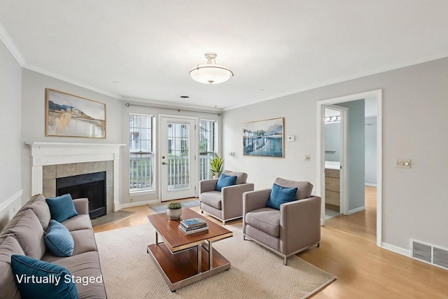 809 Harbor House Dr Unit 4, Madison, WI 53719 - living area with crown molding, wood finished floors, a fireplace, and baseboards