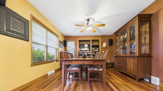 N6464 Canterbury Dr, Fond Du Lac, WI 54937 - dining space featuring wood finished floors, ceiling fan, and baseboards