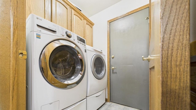 N6464 Canterbury Dr, Fond Du Lac, WI 54937 - laundry room with separate washer and dryer, light tile patterned floors, and cabinet space