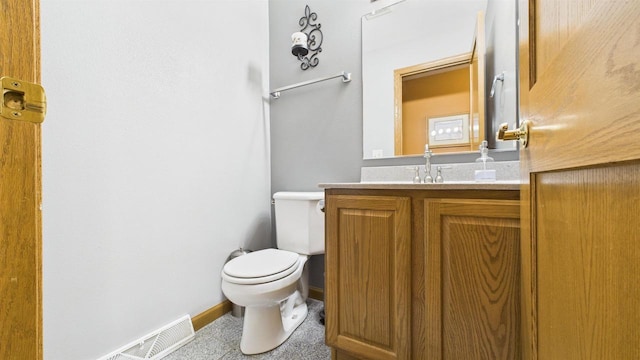N6464 Canterbury Dr, Fond Du Lac, WI 54937 - bathroom with toilet, vanity, and baseboards