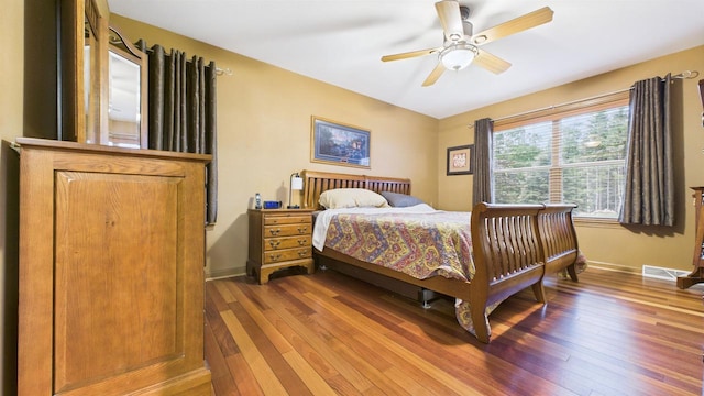 N6464 Canterbury Dr, Fond Du Lac, WI 54937 - bedroom featuring wood-type flooring, baseboards, and ceiling fan