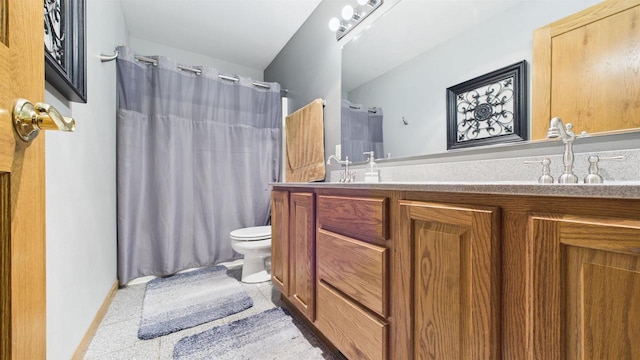 N6464 Canterbury Dr, Fond Du Lac, WI 54937 - bathroom featuring toilet, double vanity, curtained shower, and baseboards