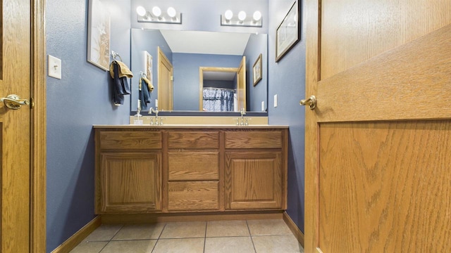 N6464 Canterbury Dr, Fond Du Lac, WI 54937 - bathroom featuring double vanity, tile patterned floors, and baseboards