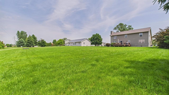 N6464 Canterbury Dr, Fond Du Lac, WI 54937 - view of green lawn with a deck
