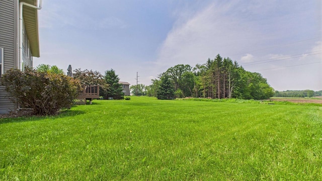 N6464 Canterbury Dr, Fond Du Lac, WI 54937 - view of grassy yard with a deck