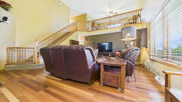 N6464 Canterbury Dr, Fond Du Lac, WI 54937 - living room with wood finished floors, plenty of natural light, ceiling fan, and a high ceiling