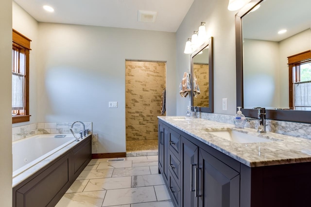 392 Campbell Hill Ct, Deforest, WI 53532 - full bathroom with marble finish floors, double vanity, a tub with jets, baseboards, and recessed lighting