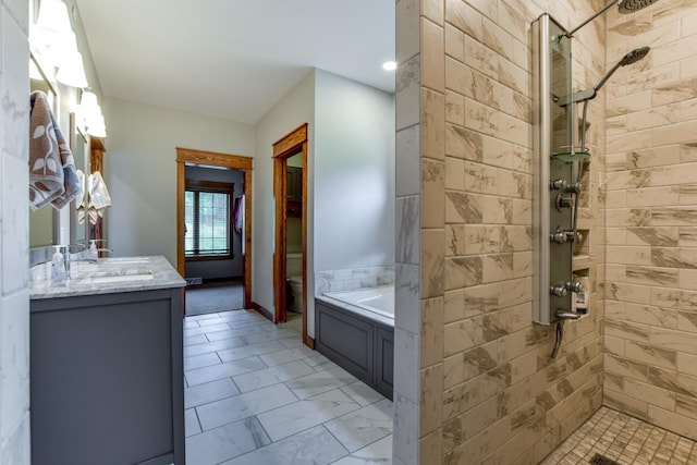 392 Campbell Hill Ct, Deforest, WI 53532 - bathroom with tiled shower, vanity, toilet, and a garden tub